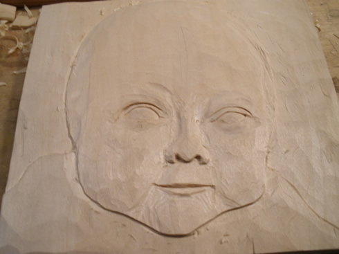 baby portrait wood carving